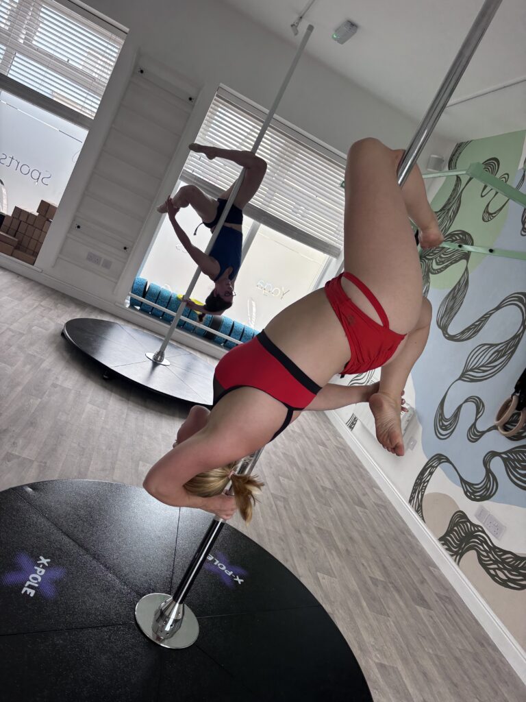 two women at newquay pole fitness class